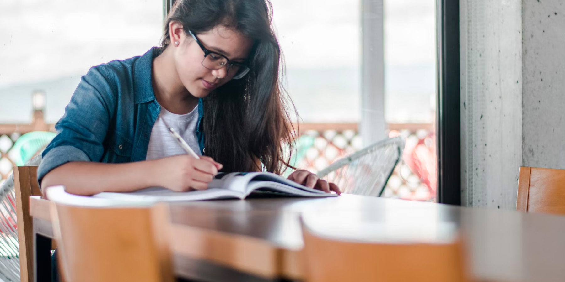 College student studying at table